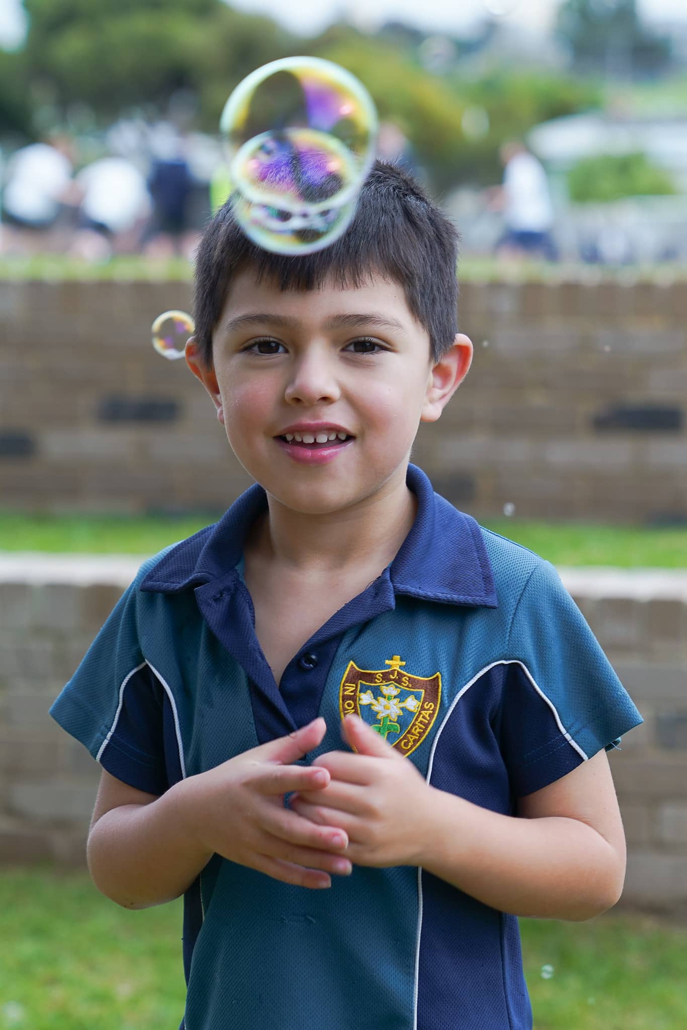 Early years student enjoying bubbles during lunchtime
